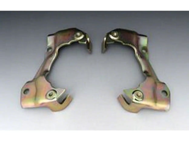 Brake caliper mounting brackets for a classic Camaro with gold-tone plated finish shown against a gray background